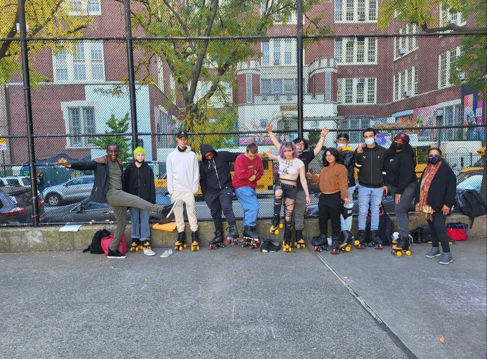 Blue Skate interns roller skating together outdoors