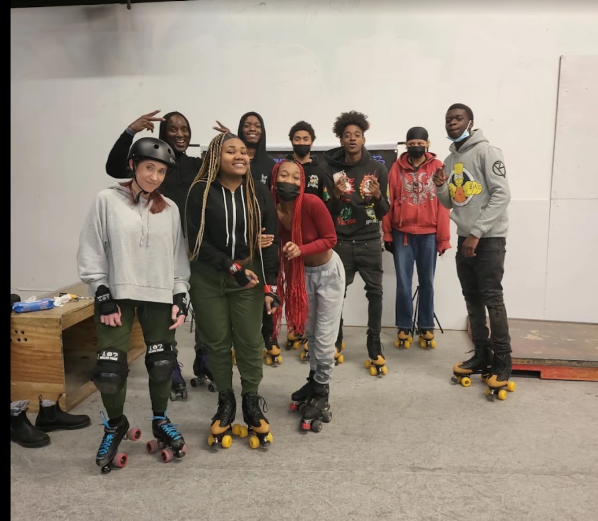 Blue Skate interns and staff in roller skates during a training session